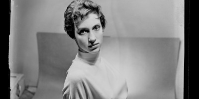 Portrait photograph of a woman in a jumper
